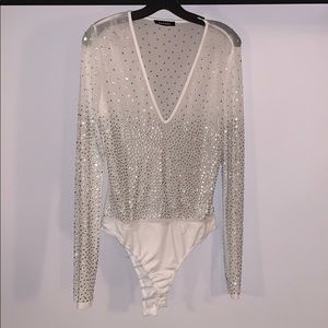 Mesh, long sleeve, bodysuit with rhinestones.